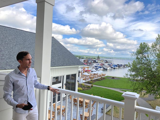 File photo: The Lake House on Canandaigua co-developer shows a view from a hotel room during a tour.